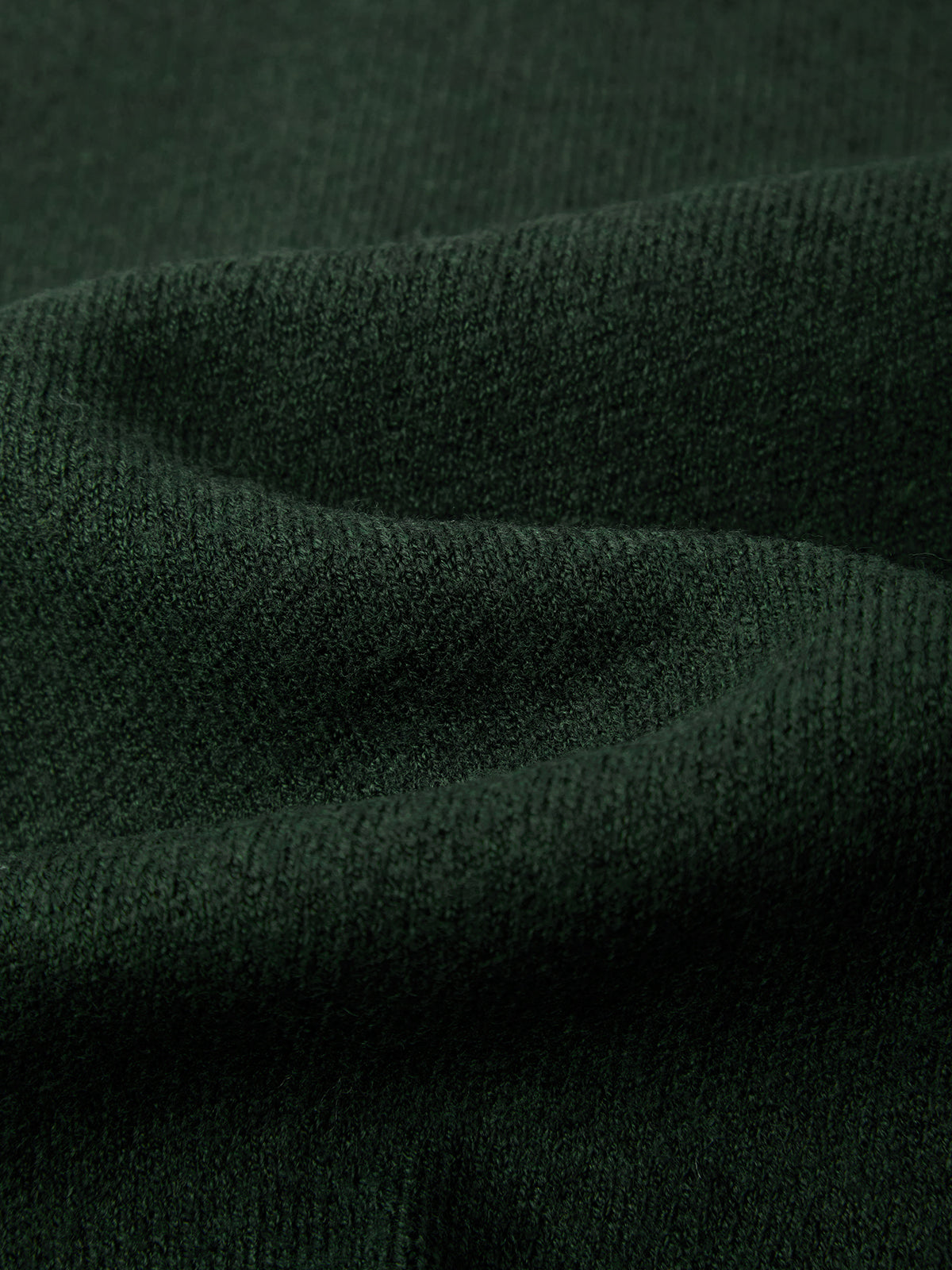 Close-up of dark green fabric texture
