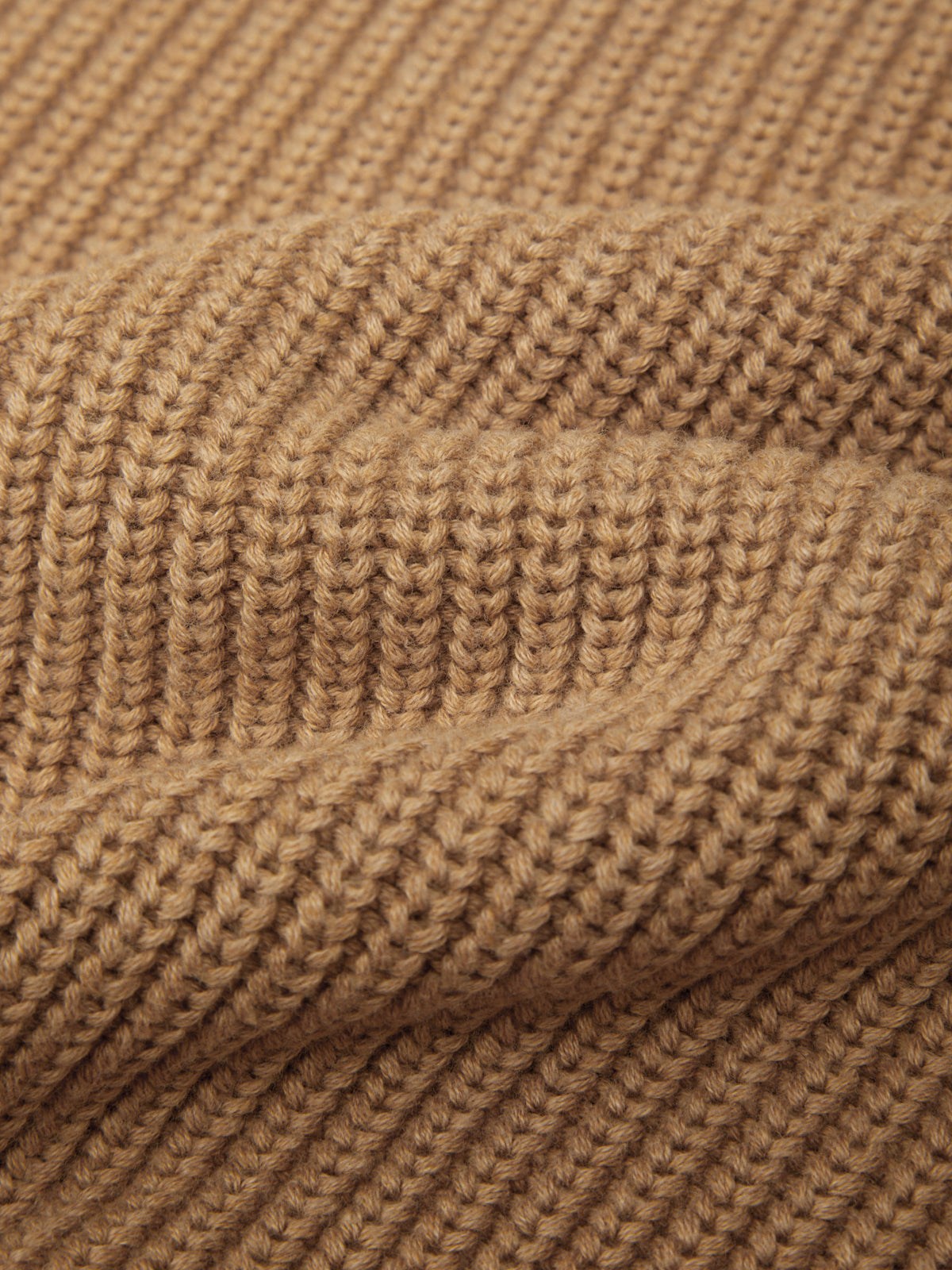 Close-up of a brown knitted fabric texture