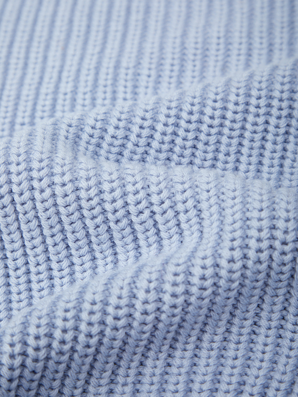 Close-up of a textured blue fabric surface