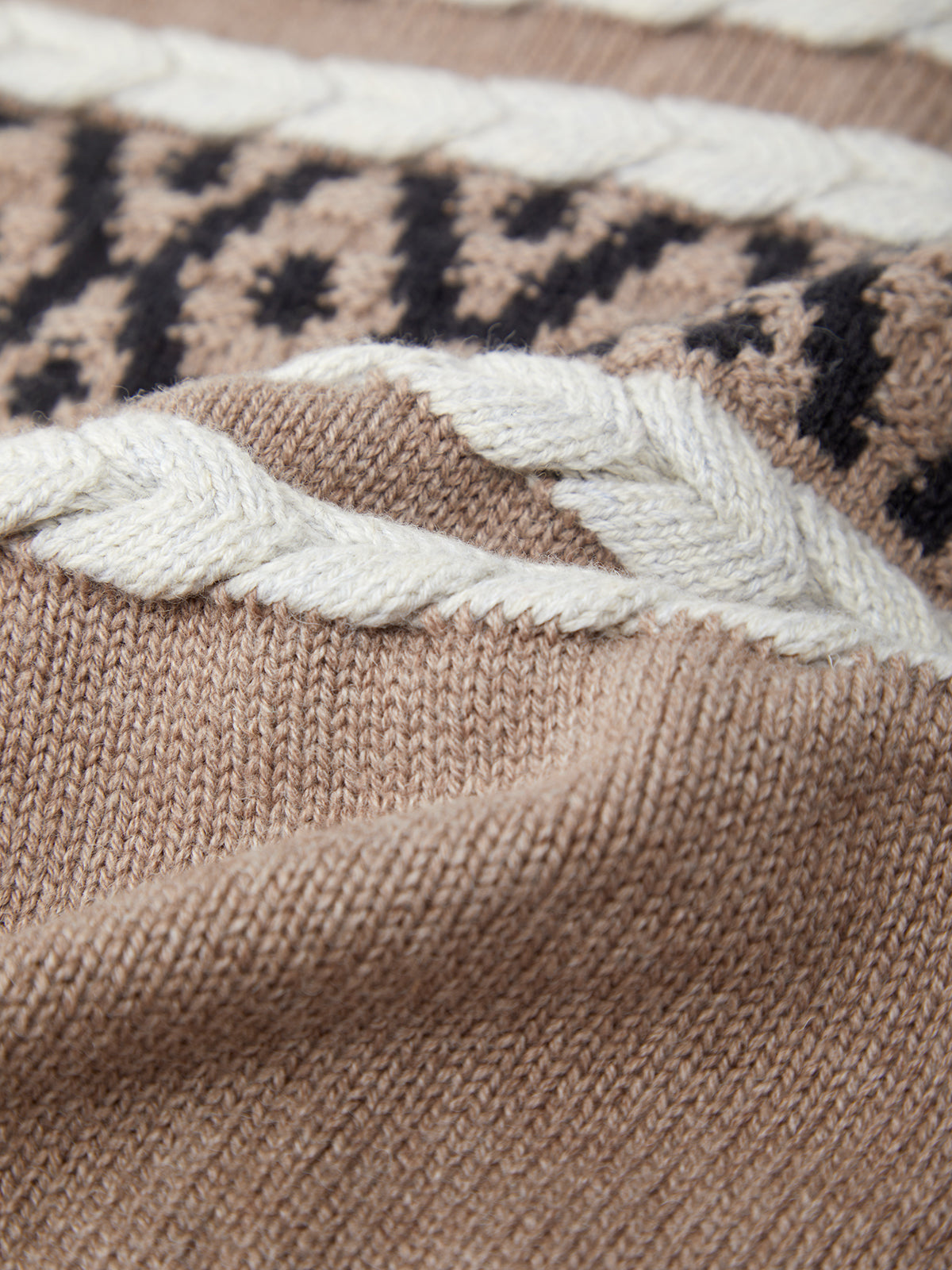 Close-up of a brown fabric with a patterned edge