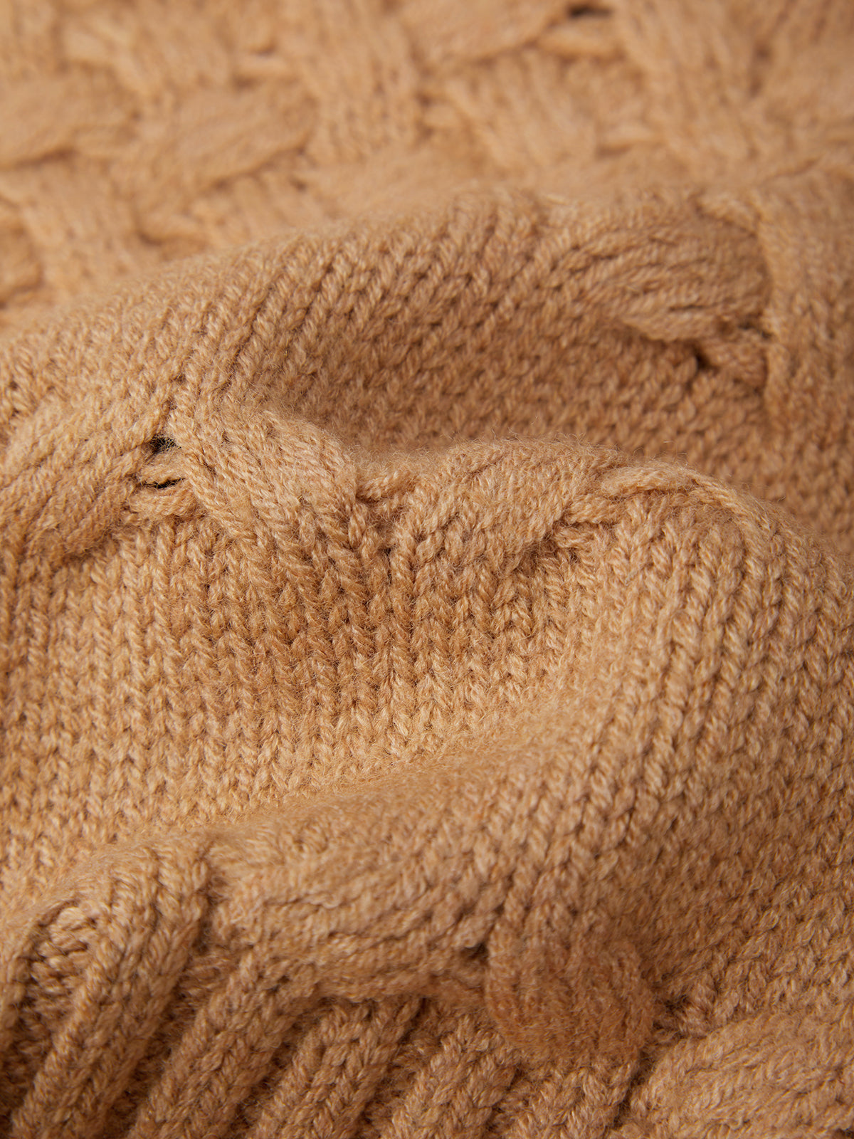 Close-up of a brown knitted fabric texture