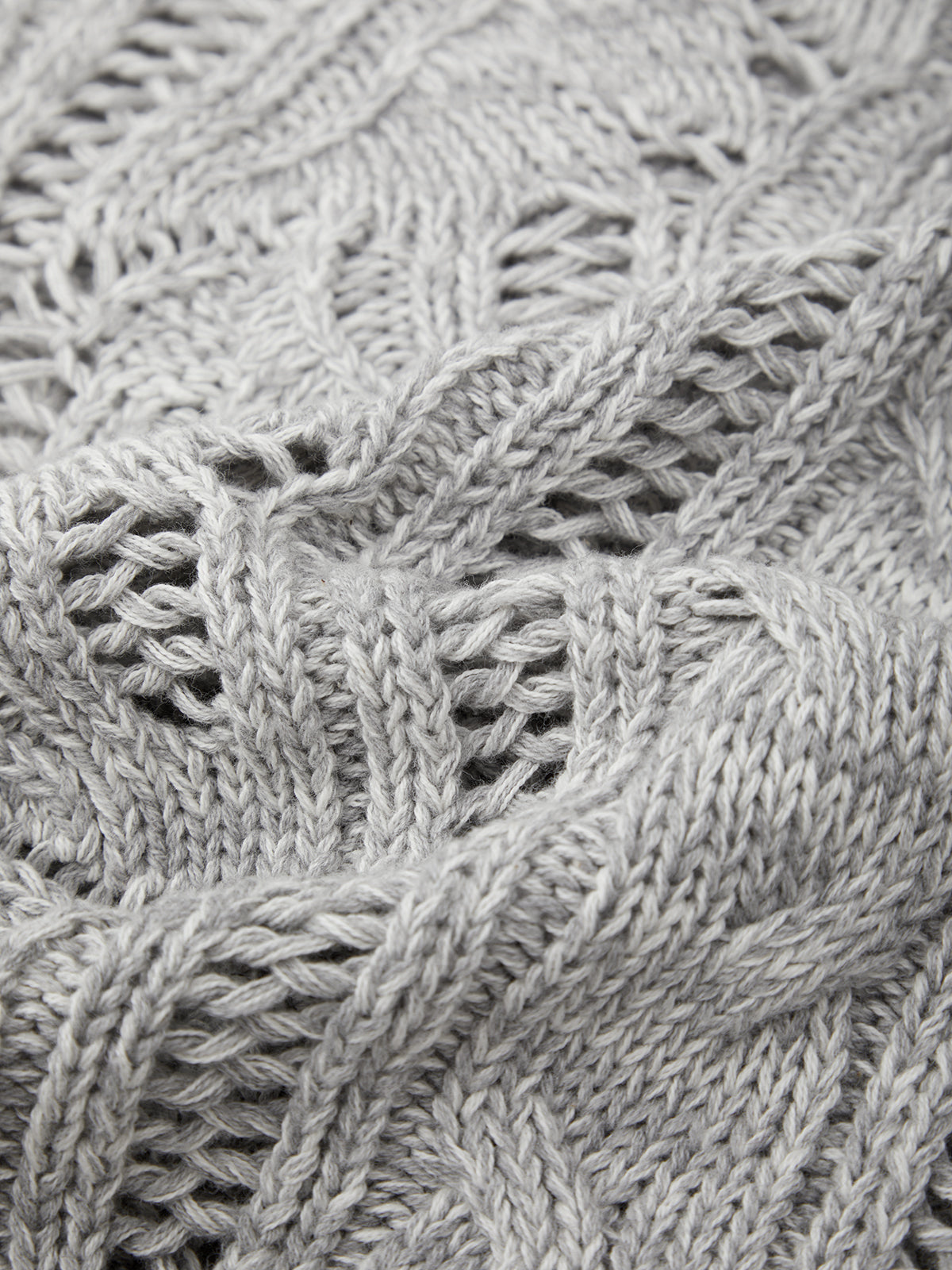 Close-up of a textured gray fabric with intricate patterns