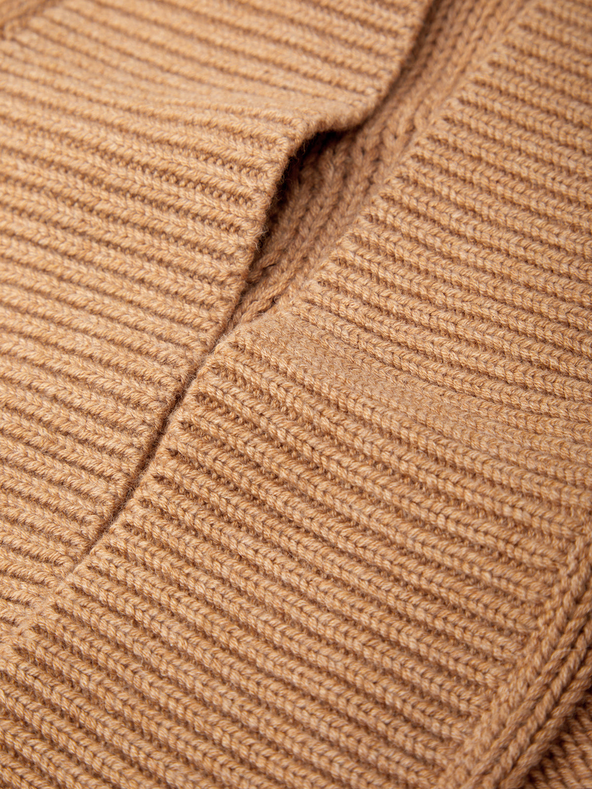 Close-up of a brown knitted fabric texture