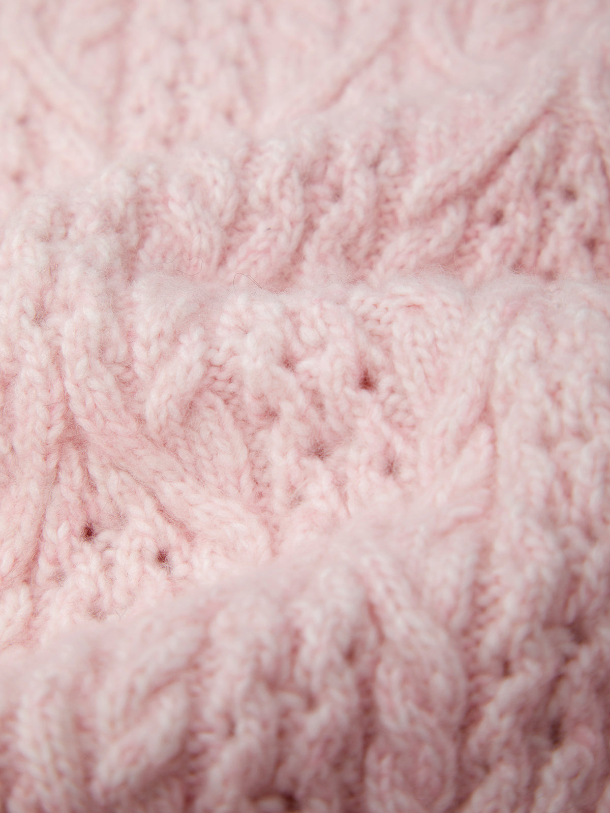 Close-up of pink knitted fabric texture
