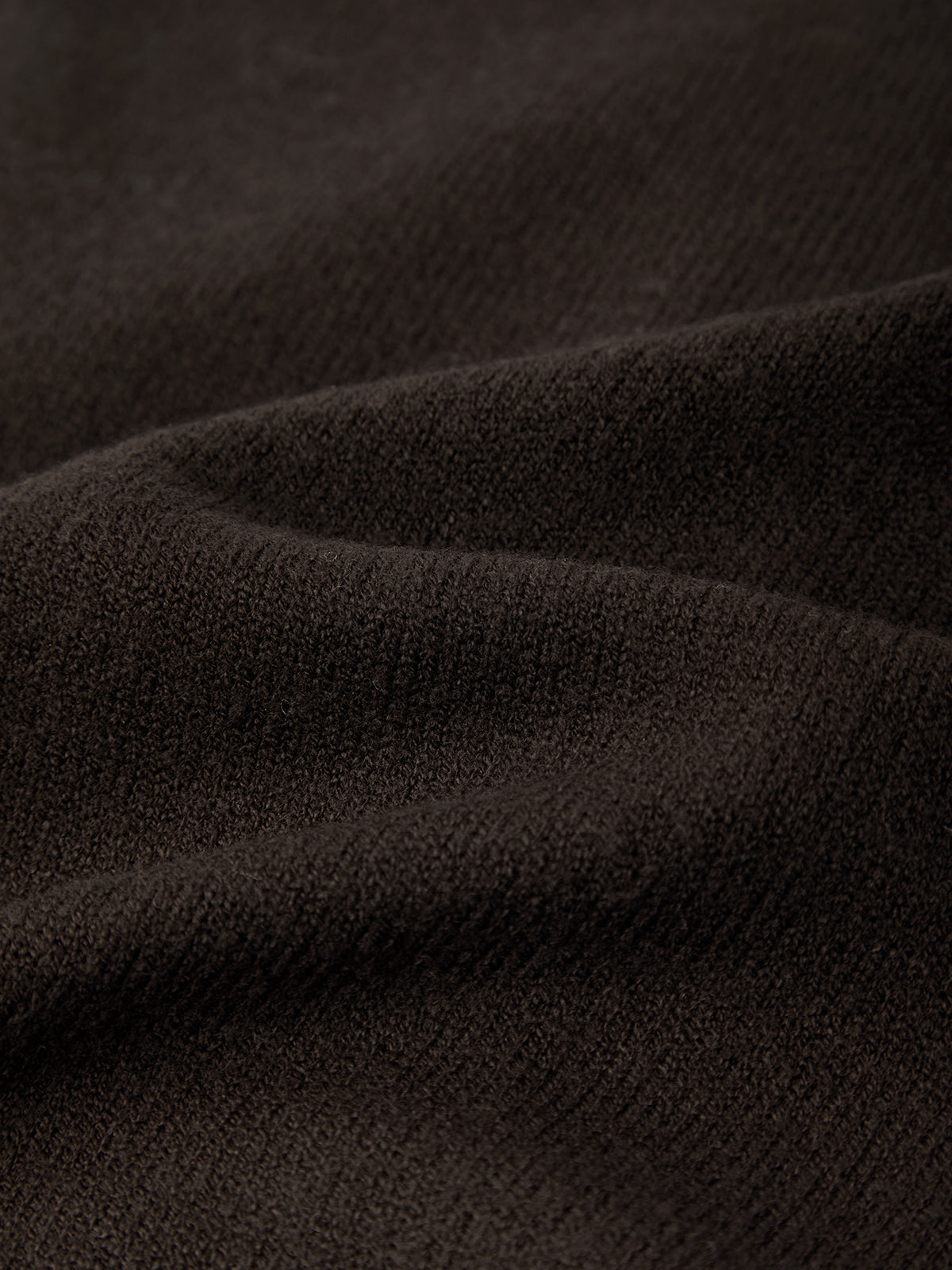 Close-up of dark brown fabric texture