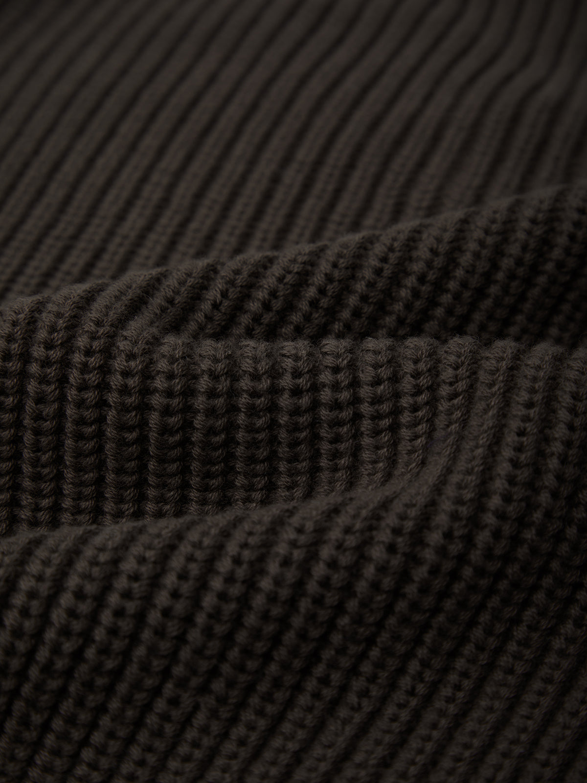 Close-up of brown ribbed fabric texture