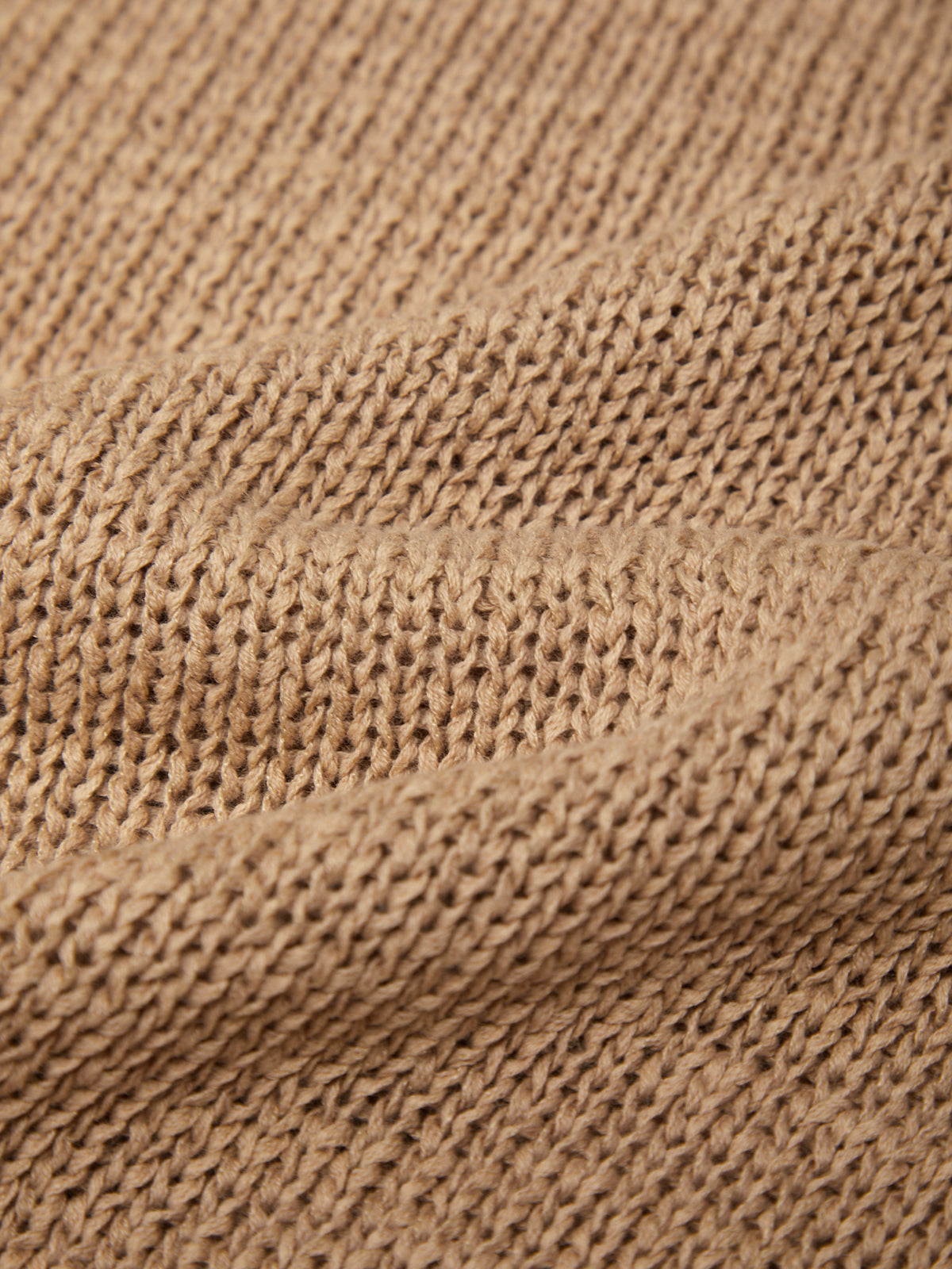 Close-up of brown knitted fabric texture