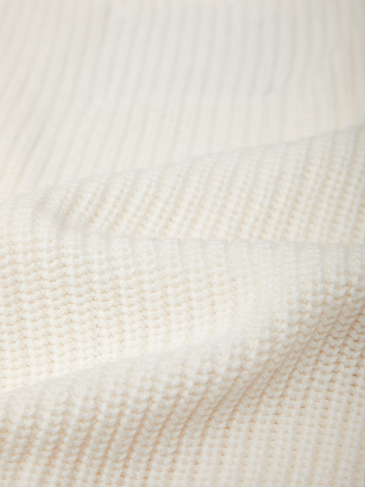 Close-up of a textured beige fabric surface