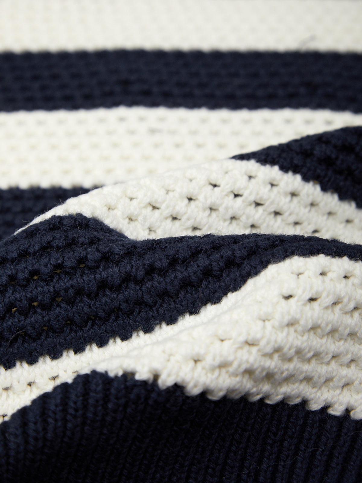 Close-up of a navy and white striped fabric texture
