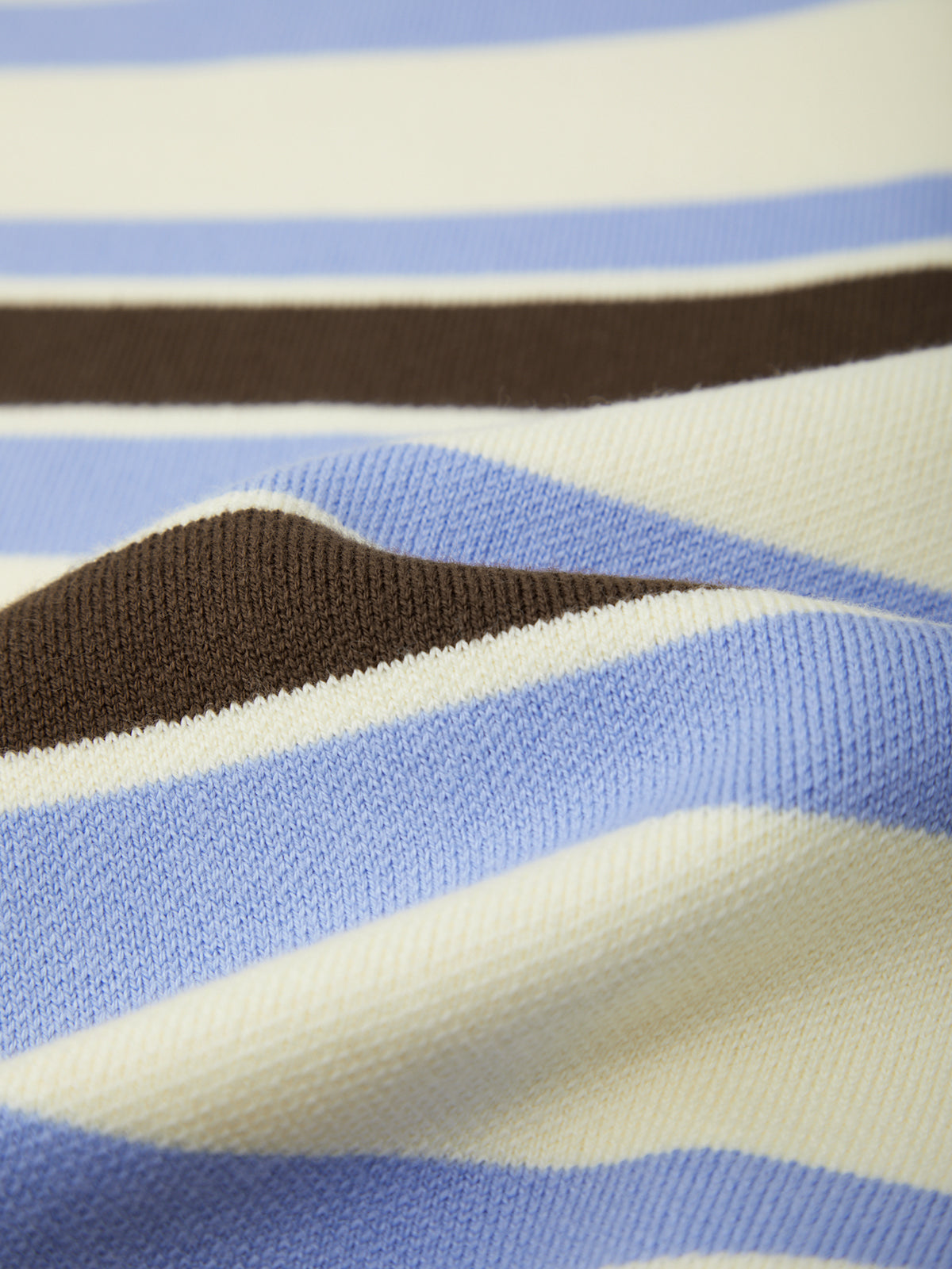 Close-up of fabric with blue, brown, and beige stripes