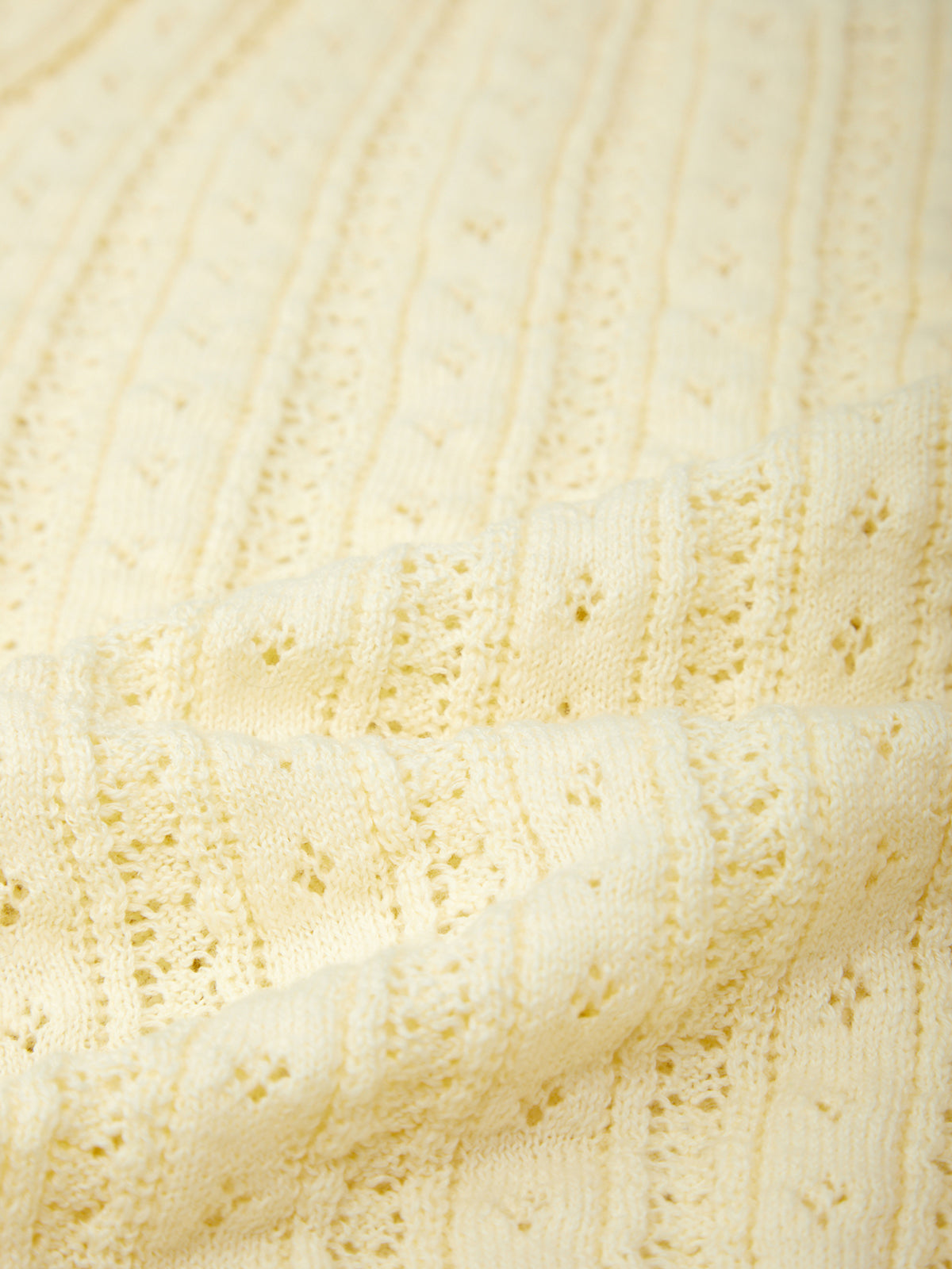 Close-up of a textured beige fabric surface