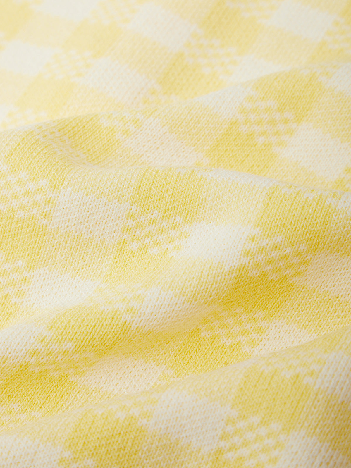 Close-up of yellow and white patterned fabric