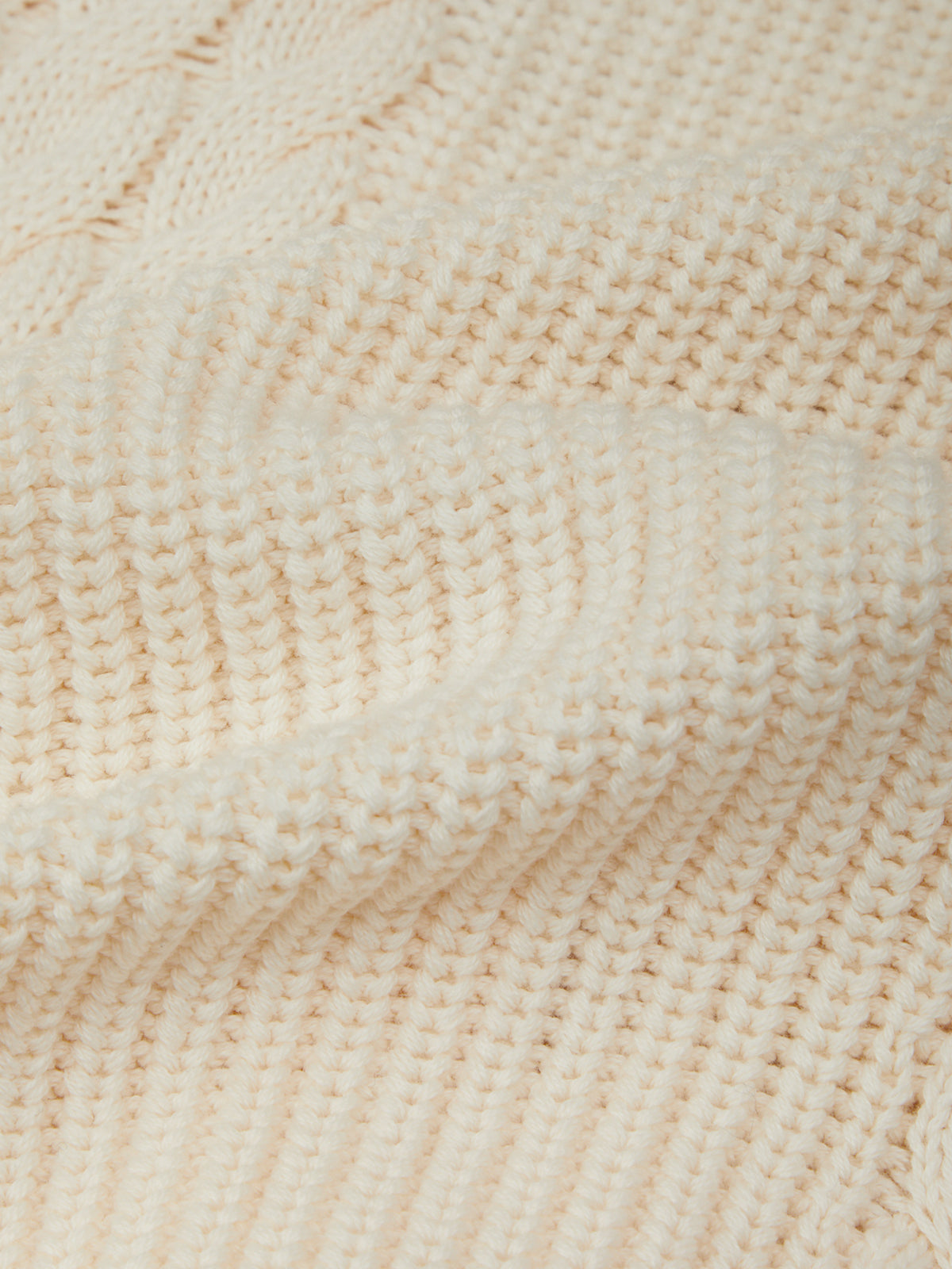 Close-up of beige woven fabric texture