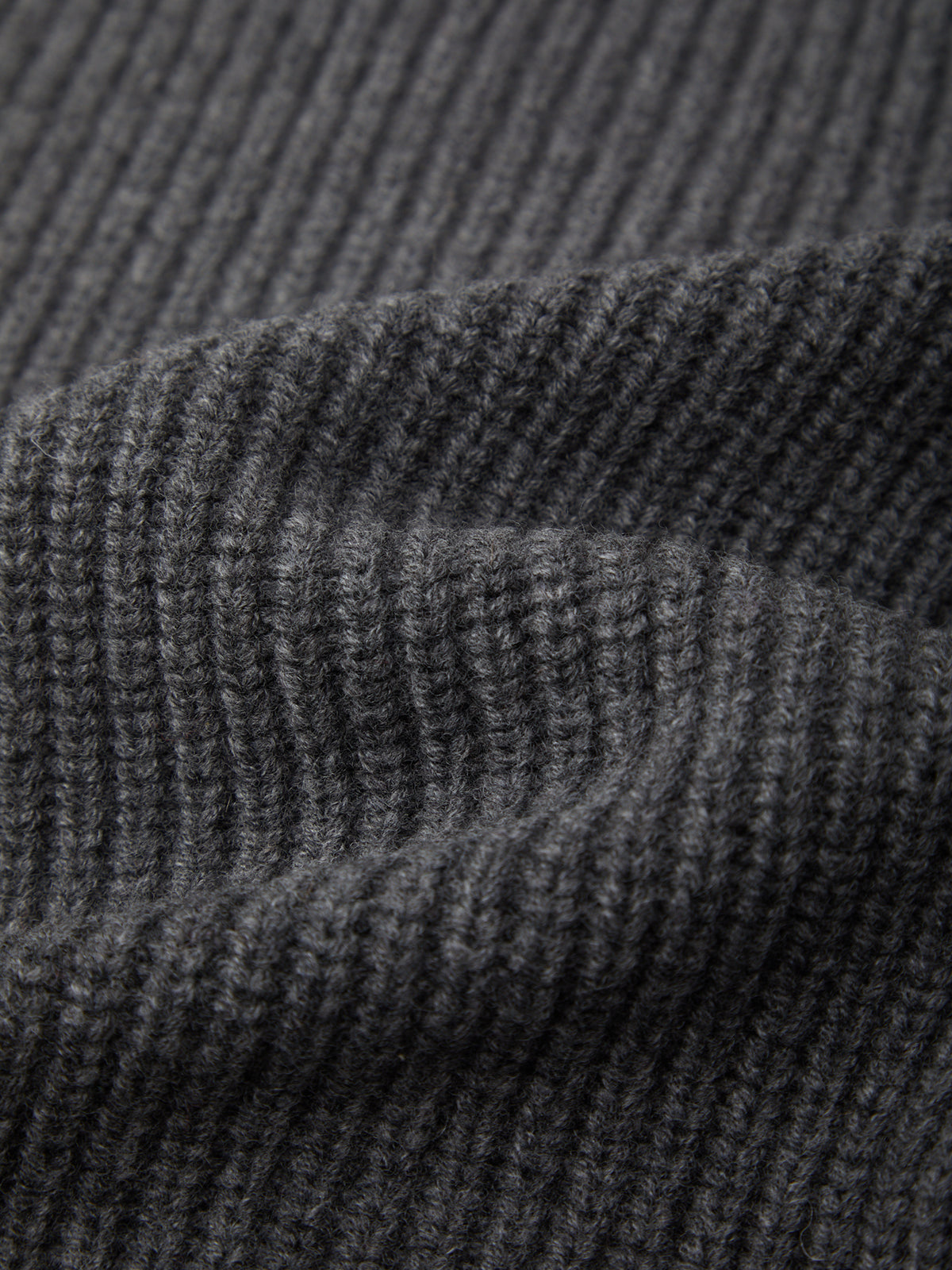Close-up of textured dark gray fabric