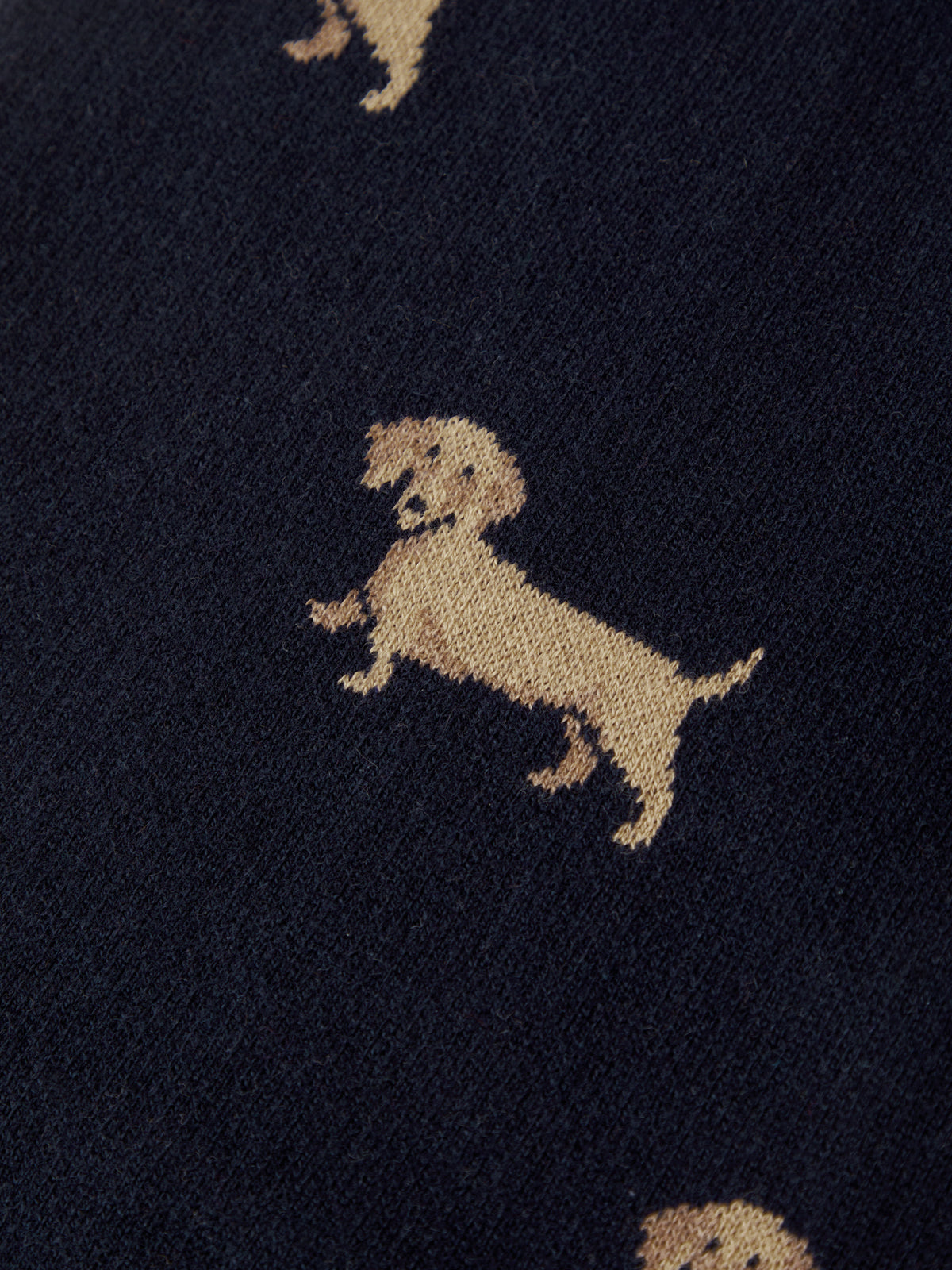Pattern of small dogs on a dark fabric background