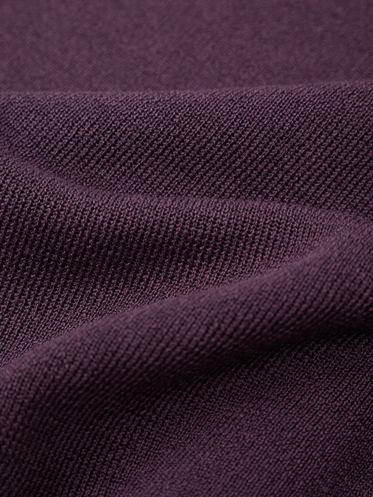 Close-up of purple fabric with a textured pattern