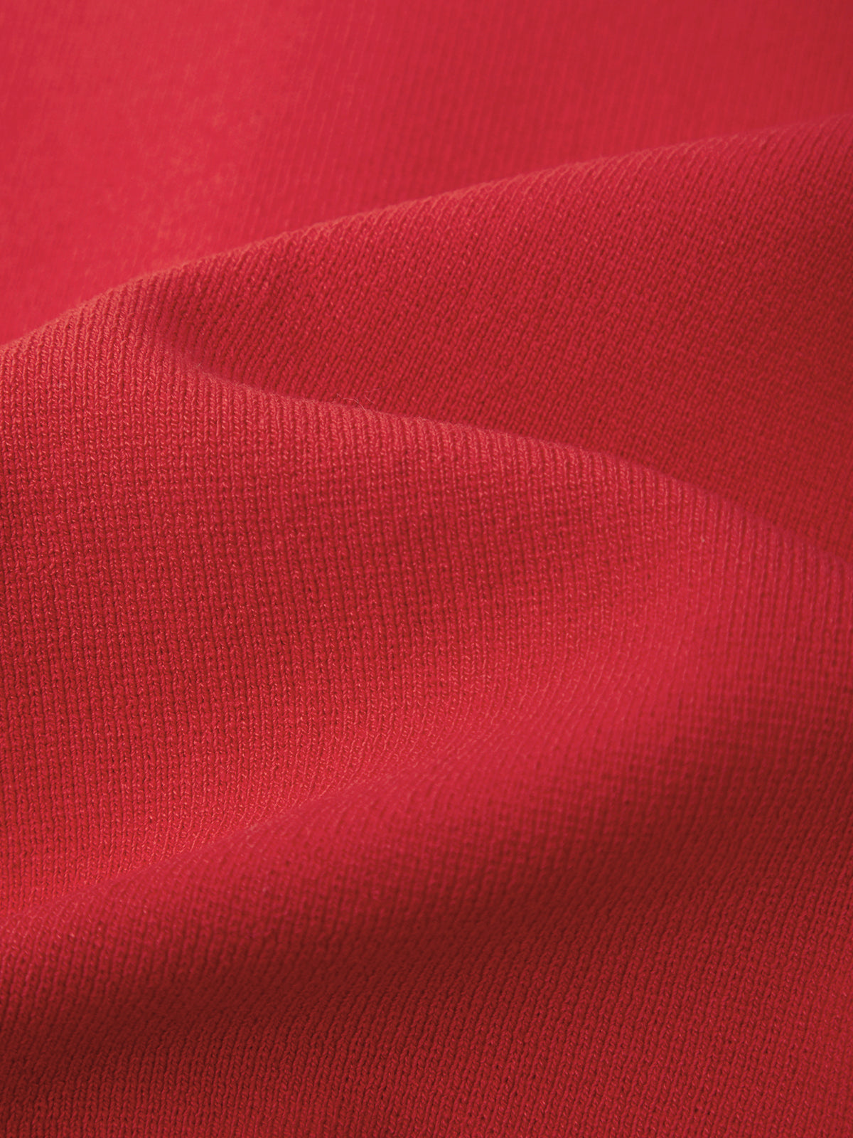 Close-up of red fabric with visible texture