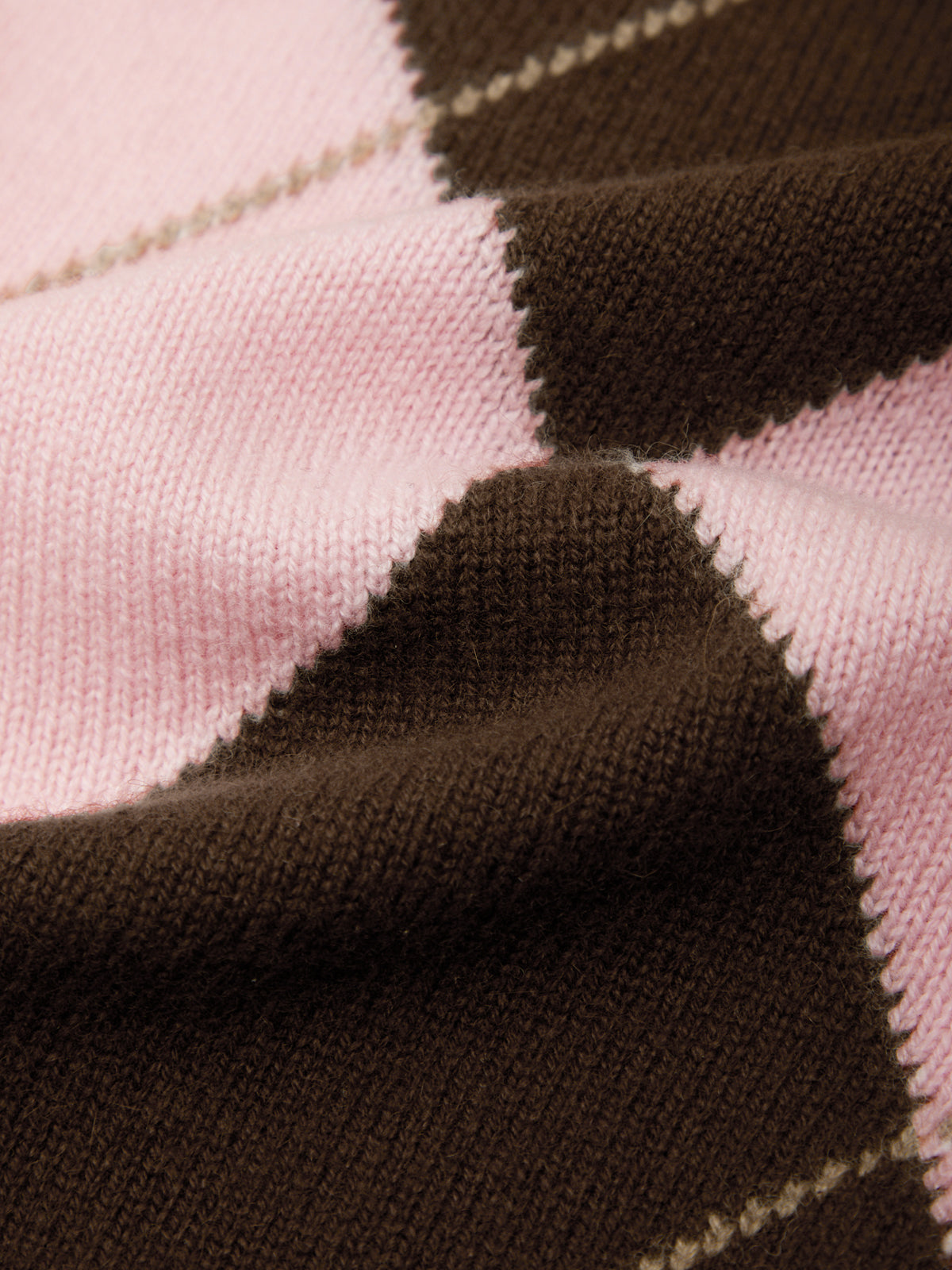 Close-up of brown and pink fabric with a checkered pattern