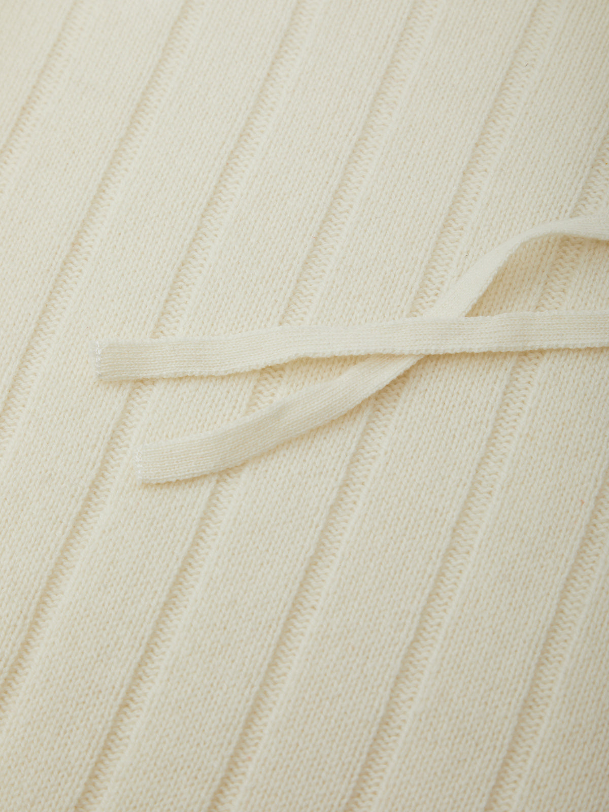 Close-up of beige fabric with a subtle pattern