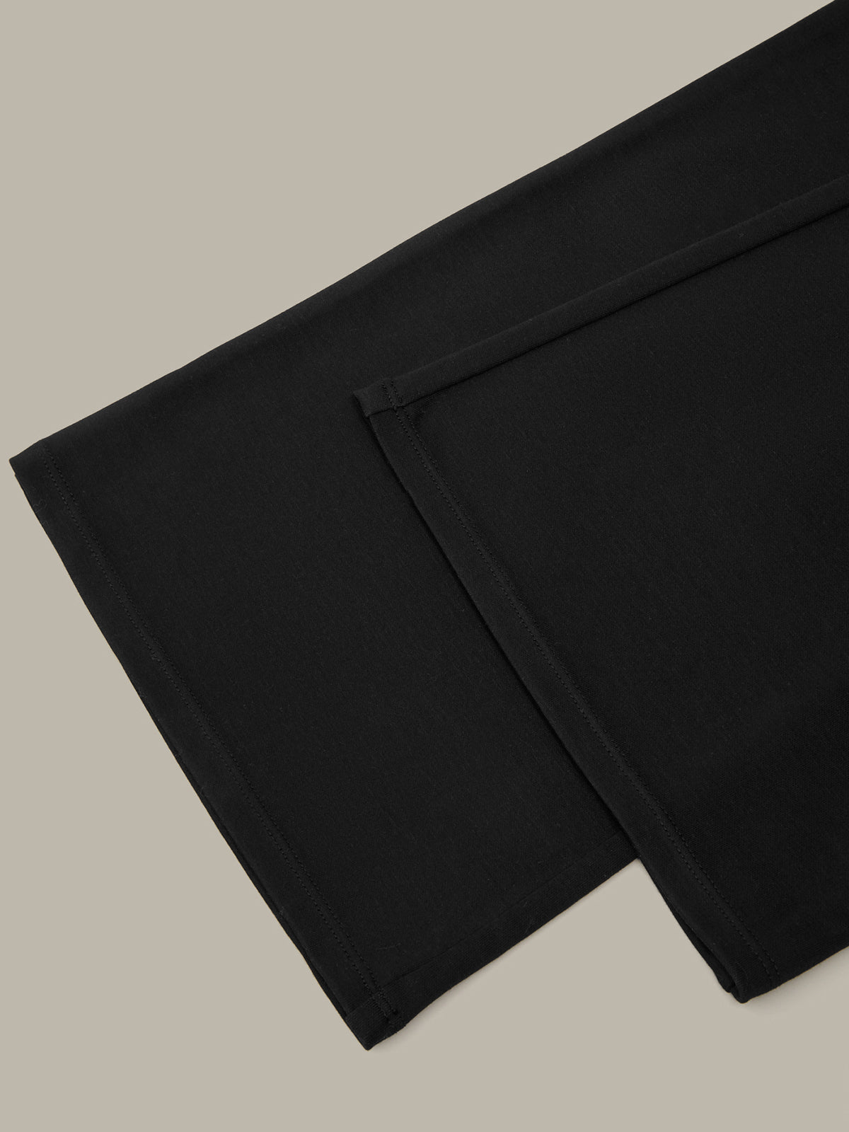 Two black napkins on a beige background