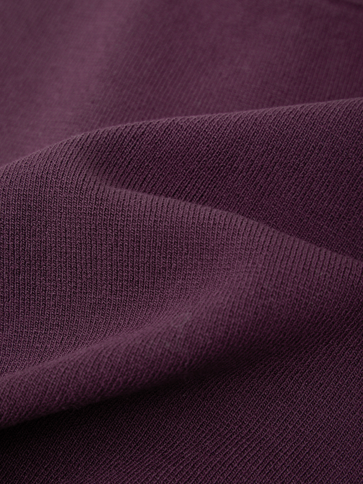 Close-up of purple fabric with visible texture