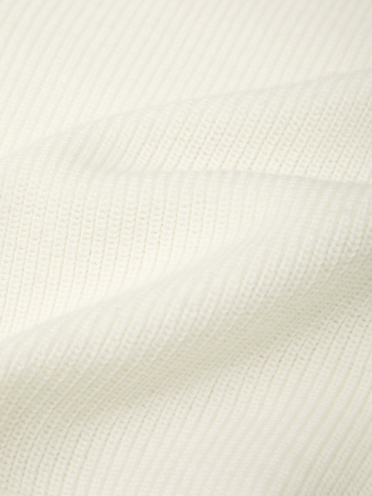 Close-up of a textured white fabric surface