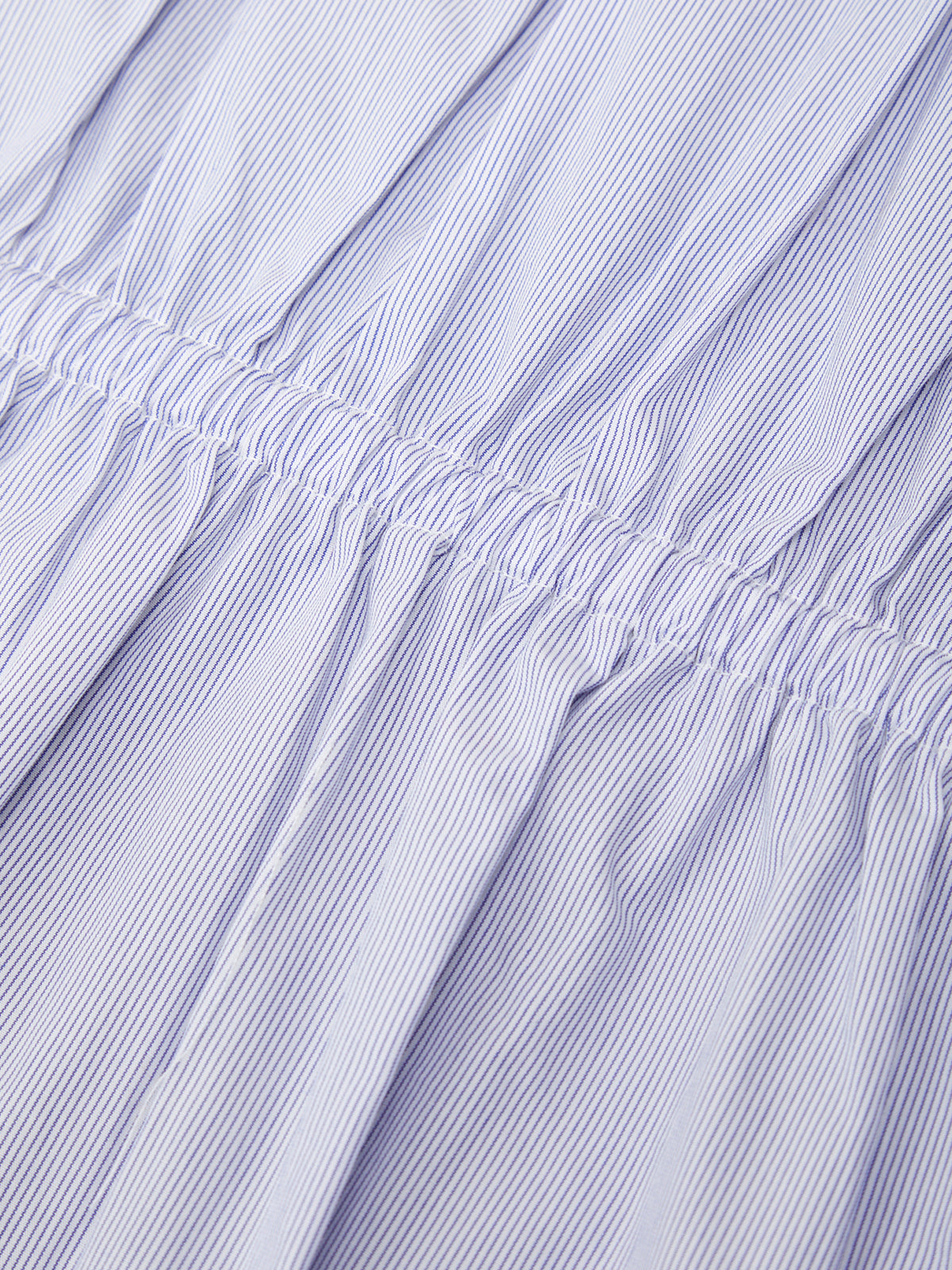 Close-up of a textured purple fabric with visible folds