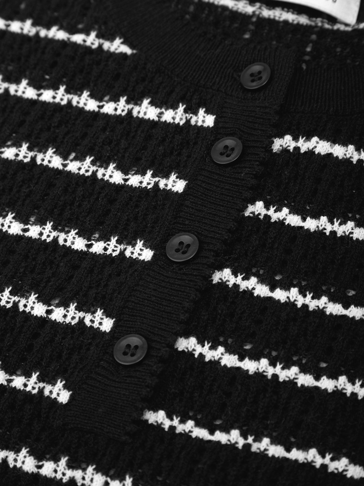Black and white striped fabric with button details