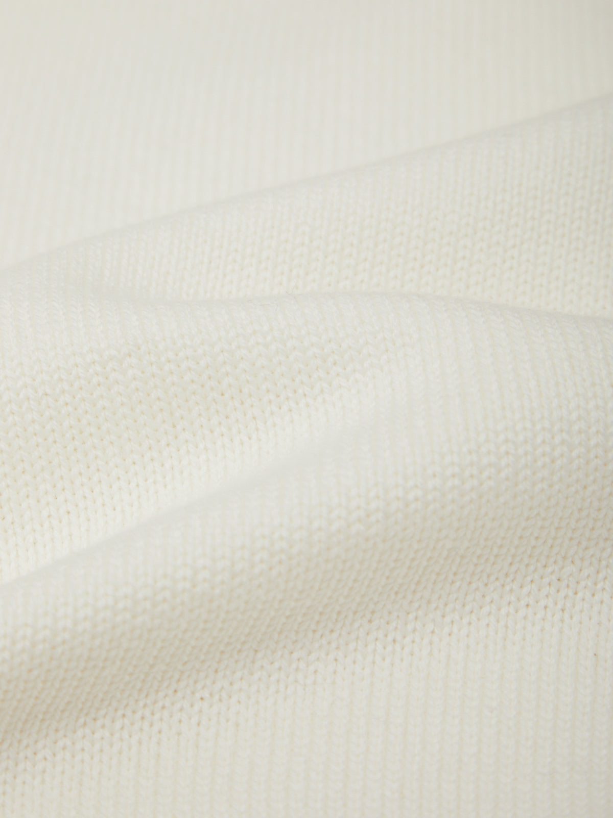 Close-up of a textured white fabric surface
