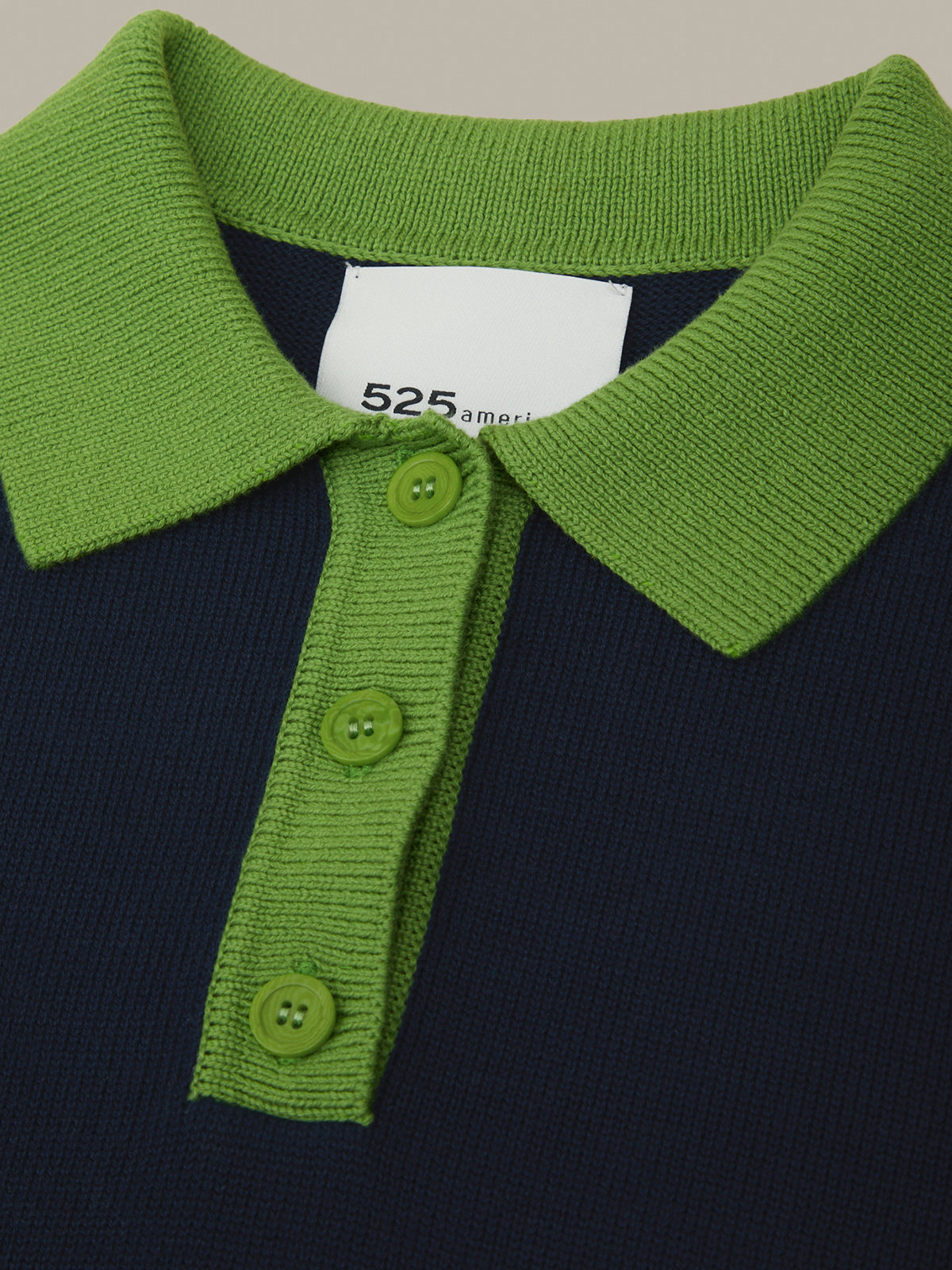Green collar with buttons on a dark background