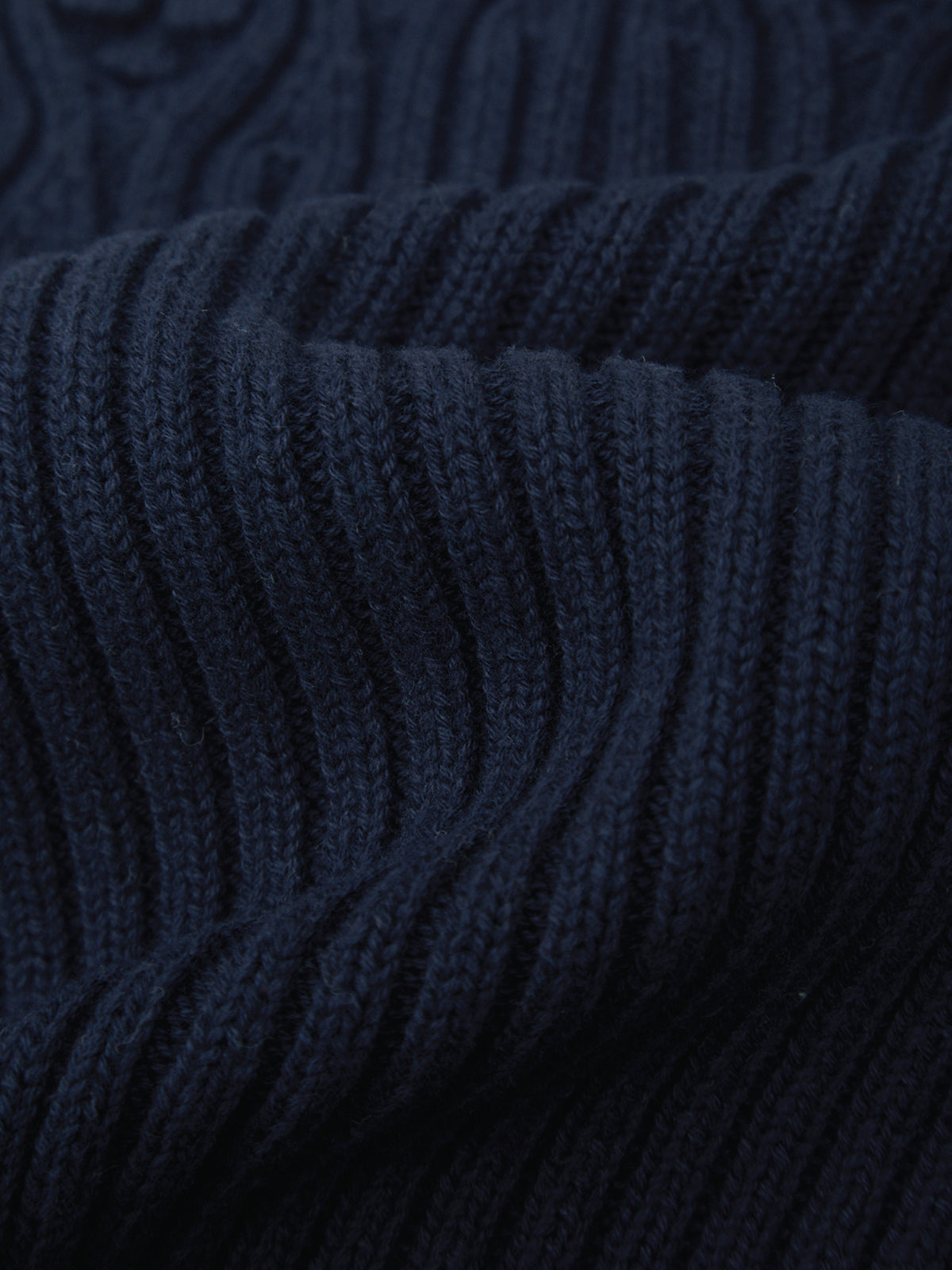 Close-up of dark blue ribbed fabric texture