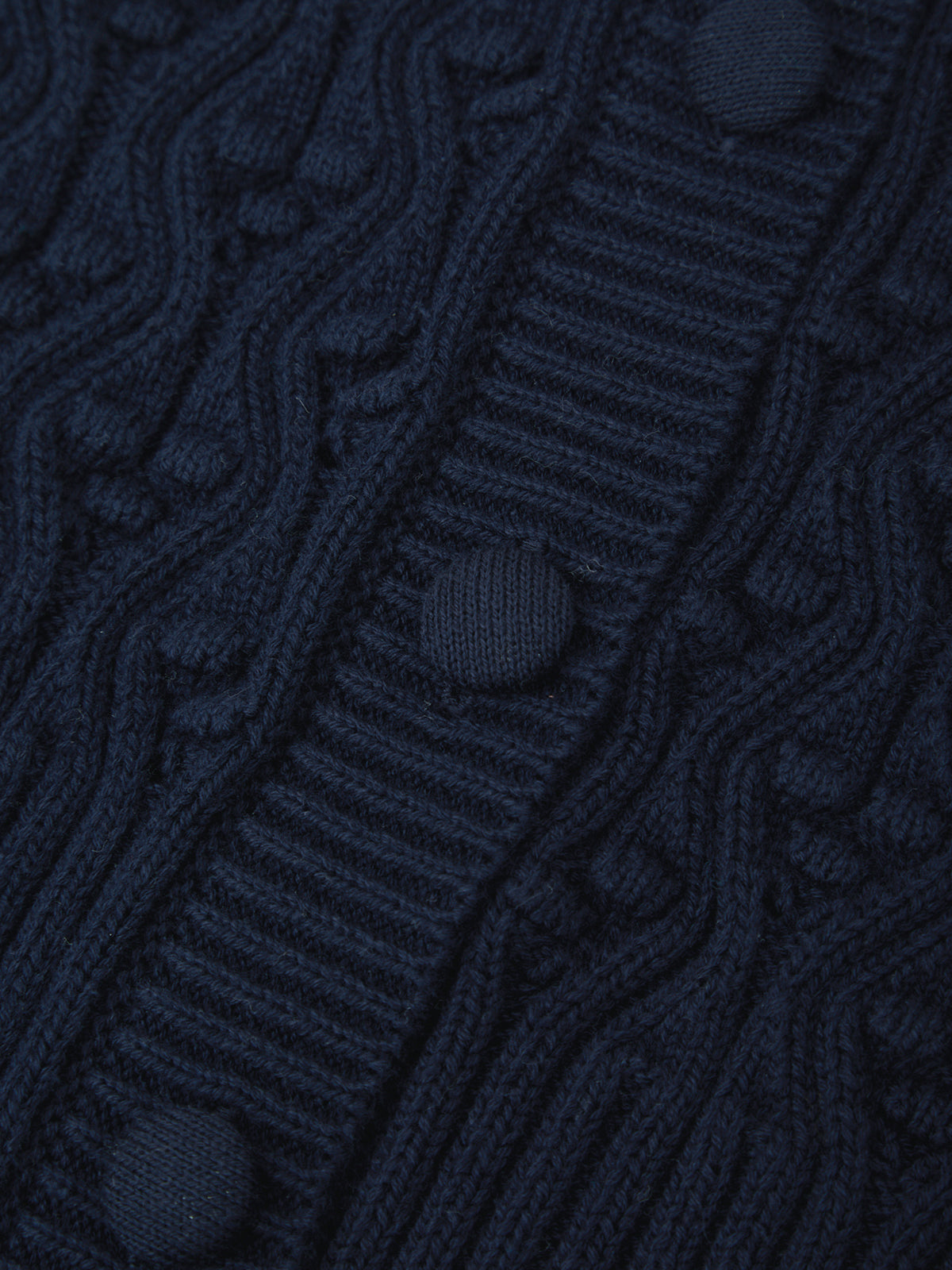 Close-up of dark blue textured fabric with wavy pattern