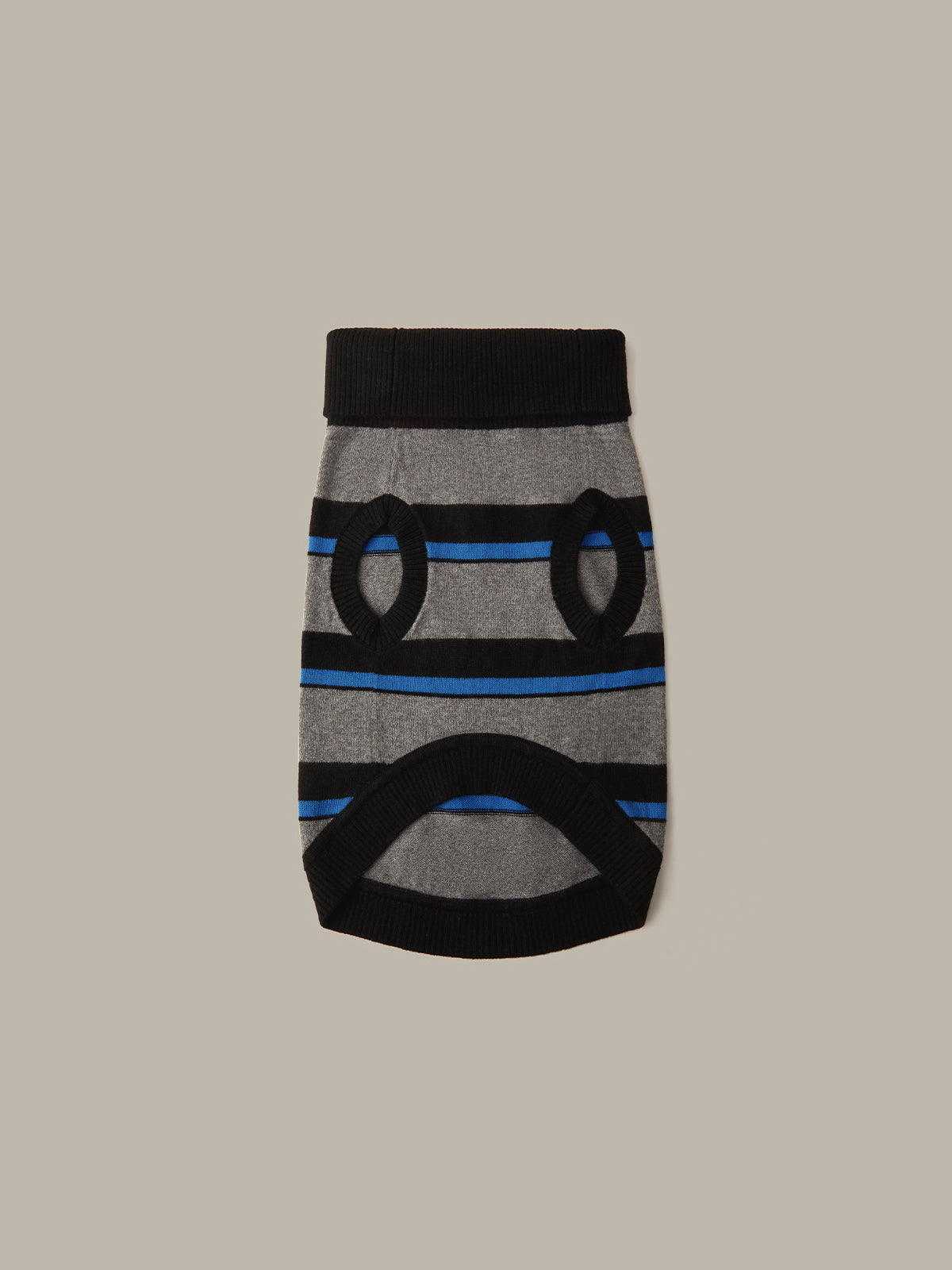 A gray knit pet sweater with black ribbed trim and blue stripes, featuring two circular cutouts on the front, shown against a solid taupe background.