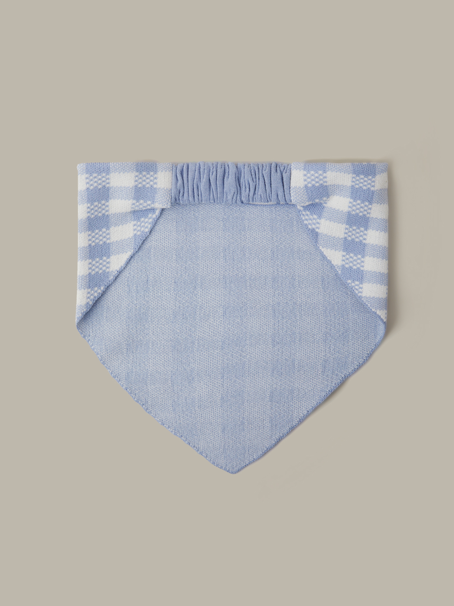 Blue checkered fabric on a beige background