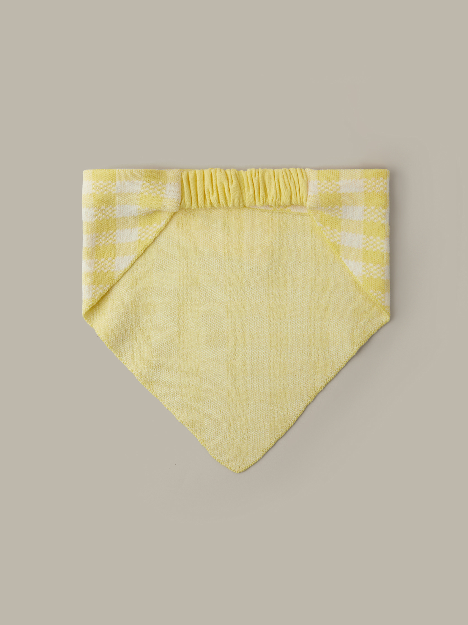 Yellow checkered bandana on a beige background