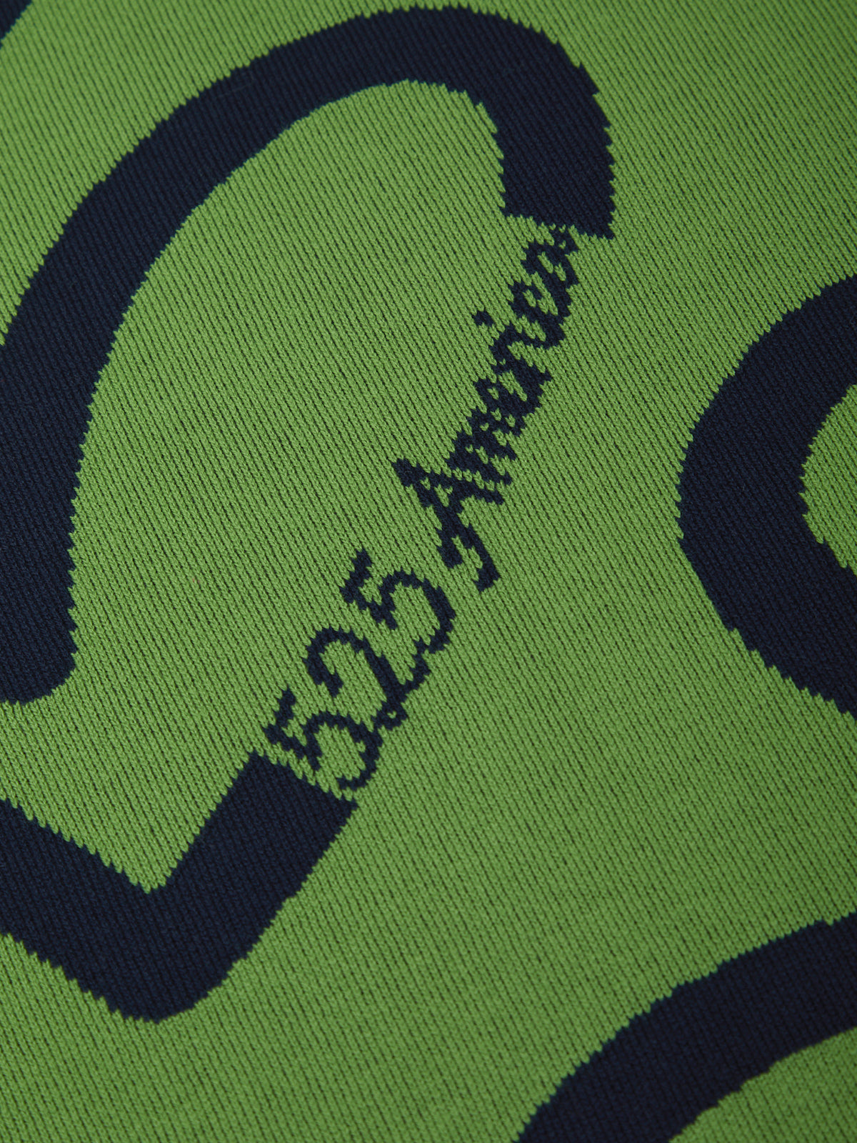 Green sock with black zigzag pattern and '525 America' text