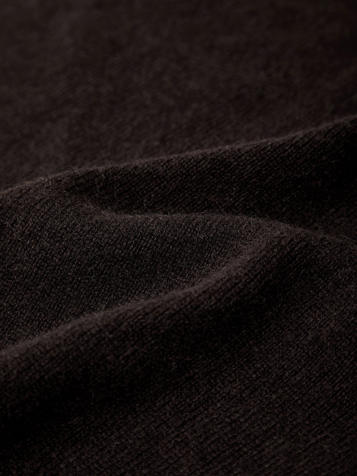 Close-up of dark brown fabric texture